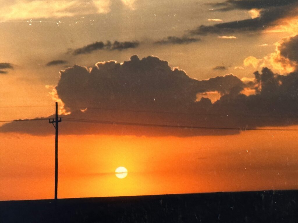 Sunset and utility poles in western Kansas, June 1988