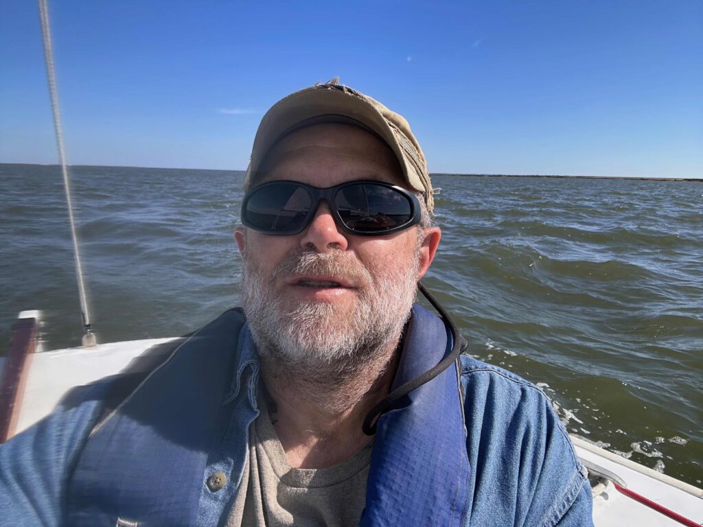 author sailing on a Rhodes 19 out of Landings Harbor