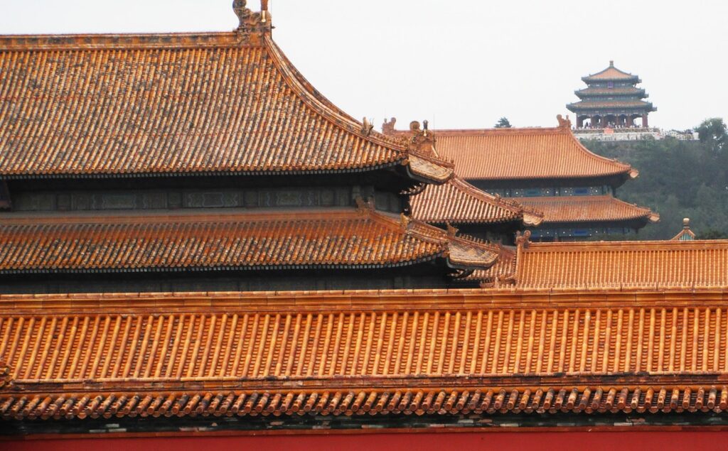 The Forbidden City with the temple on a hill behind it.