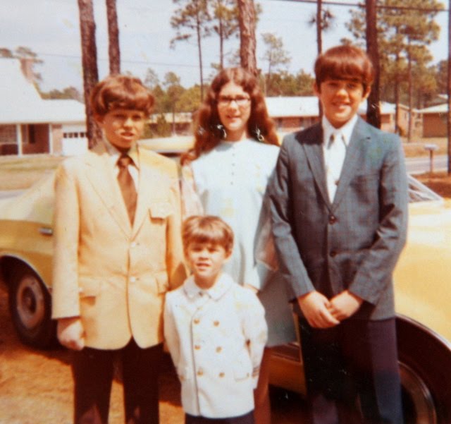 Me (to the left) with my siblings in front of my Dad's Ford Torino in the early 70s