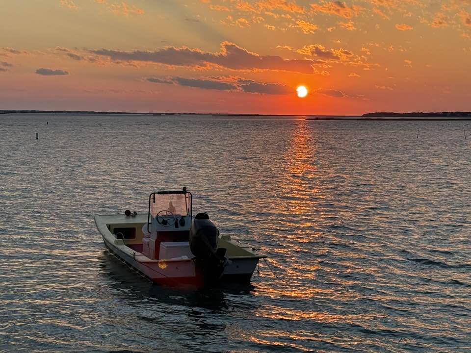 Boat on Harker's Island at sunset