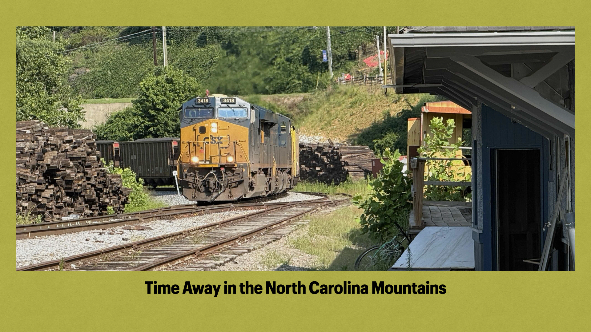 Title slide with photo of a CSX coal train descending through Spruce Pine, NC